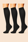 Three pairs of black compression socks displayed together
