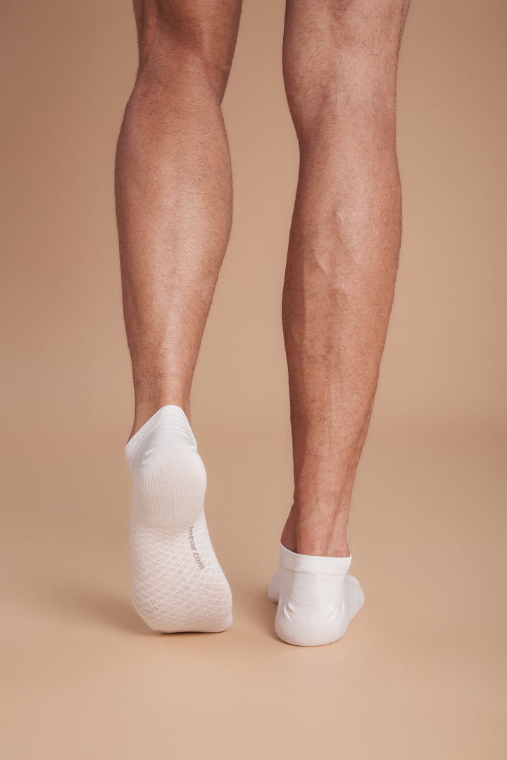 Soft women’s antibacterial ankle socks with massage sole design, breathable fabric, comfortable fit, and odor-resistant material perfect for daily wear and foot care.