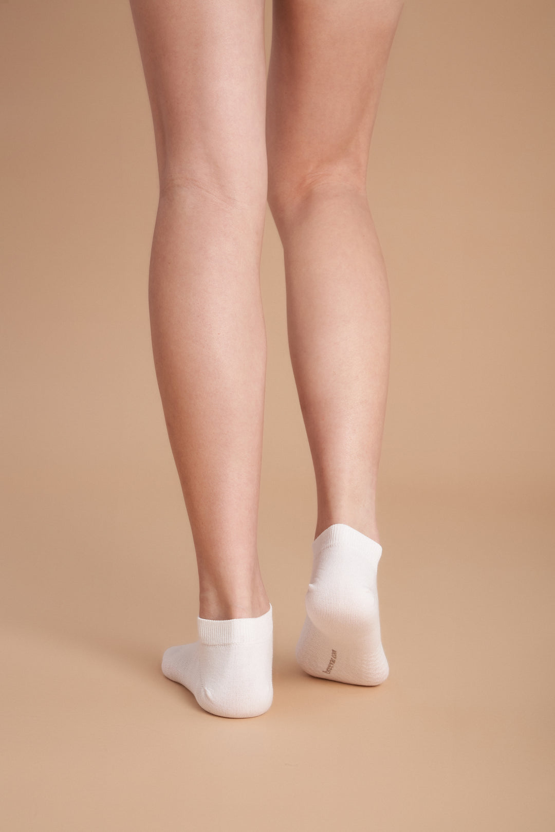 Soft women’s antibacterial ankle socks with massage sole design, breathable fabric, comfortable fit, and odor-resistant material perfect for daily wear and foot care.