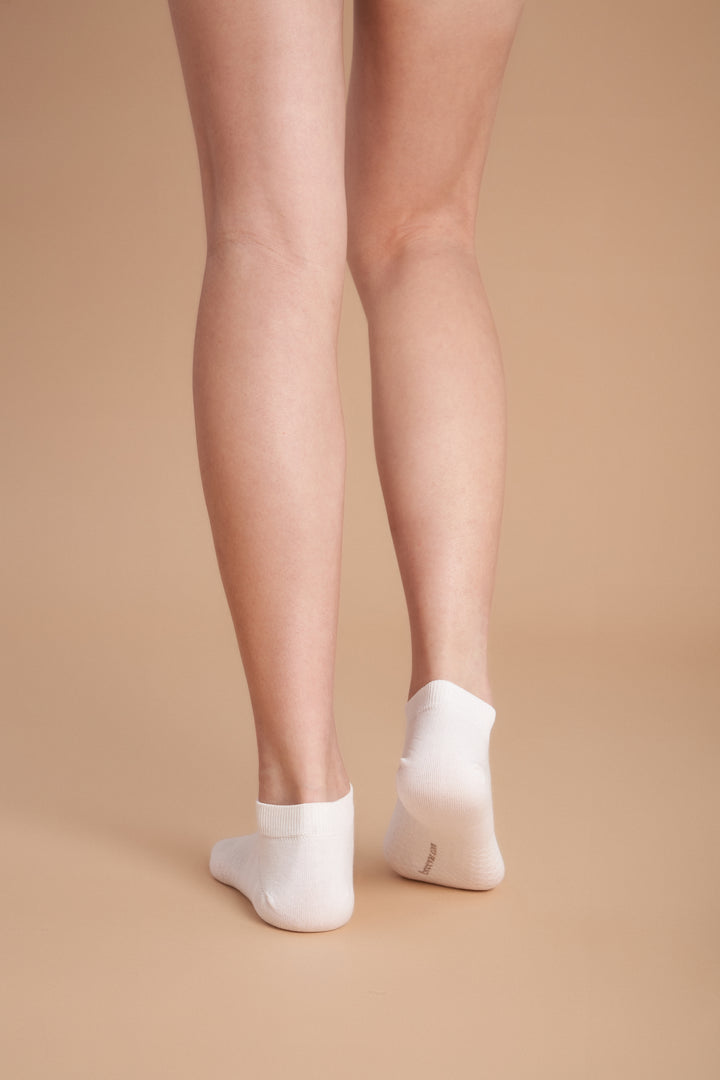 Soft women’s antibacterial ankle socks with massage sole design, breathable fabric, comfortable fit, and odor-resistant material perfect for daily wear and foot care.