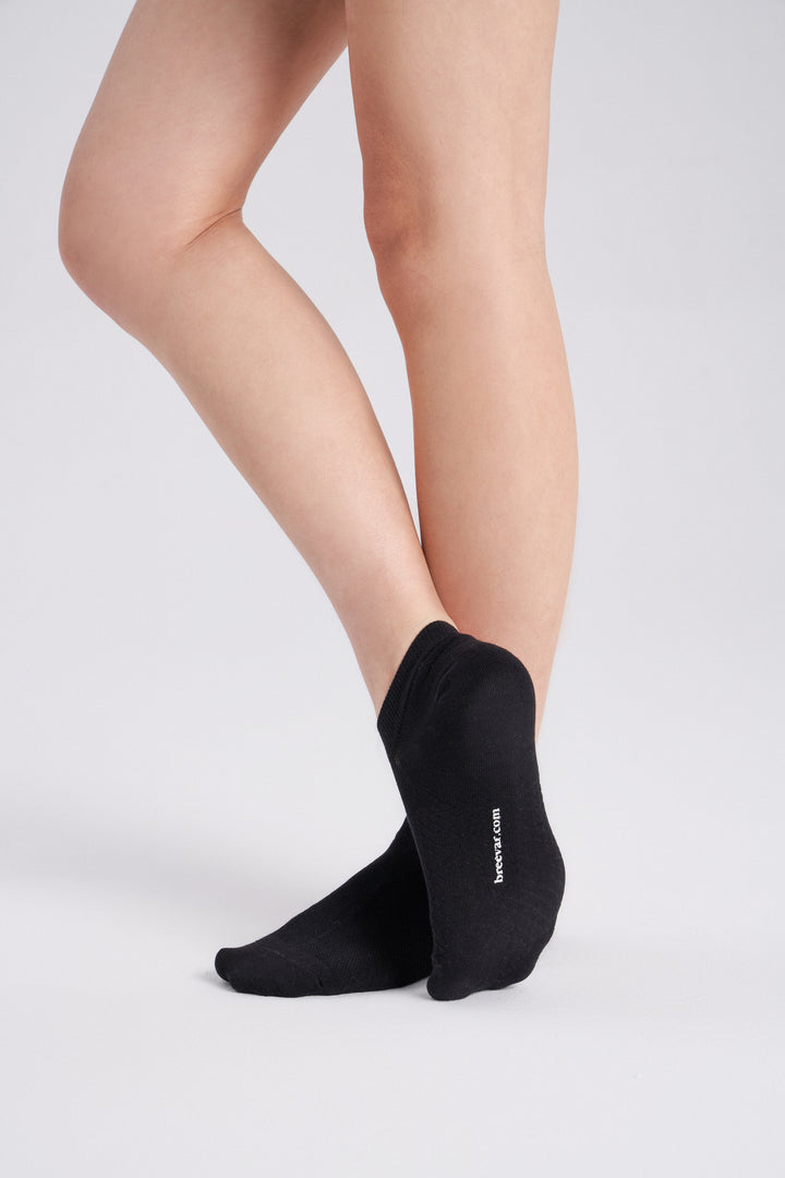 Soft women’s antibacterial ankle socks with massage sole design, breathable fabric, comfortable fit, and odor-resistant material perfect for daily wear and foot care.
