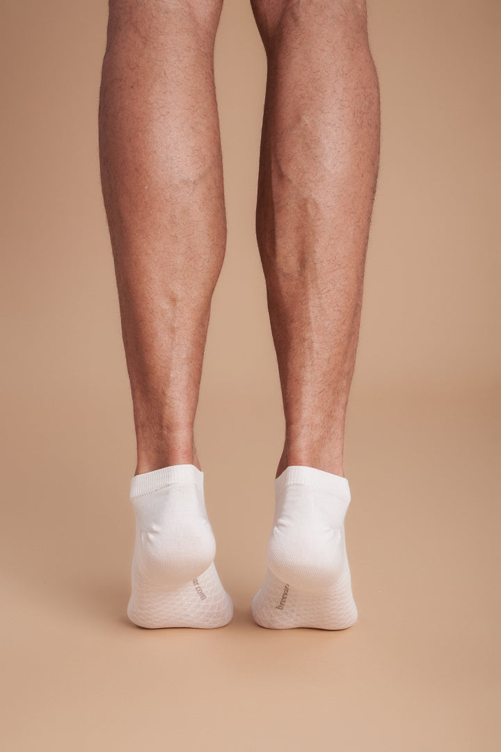 Soft women’s antibacterial ankle socks with massage sole design, breathable fabric, comfortable fit, and odor-resistant material perfect for daily wear and foot care.