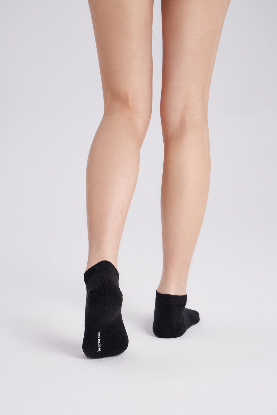 Soft women’s antibacterial ankle socks with massage sole design, breathable fabric, comfortable fit, and odor-resistant material perfect for daily wear and foot care.