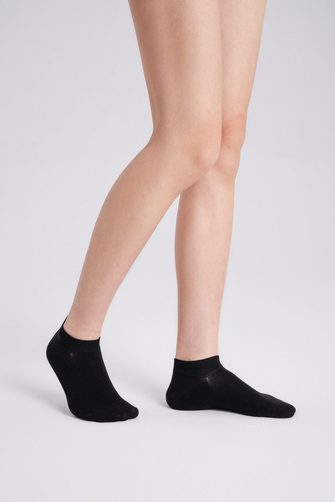 Soft women’s antibacterial ankle socks with massage sole design, breathable fabric, comfortable fit, and odor-resistant material perfect for daily wear and foot care.