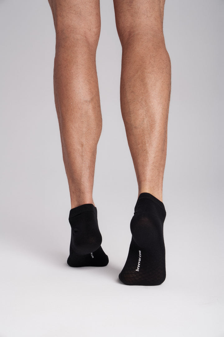 Soft women’s antibacterial ankle socks with massage sole design, breathable fabric, comfortable fit, and odor-resistant material perfect for daily wear and foot care.