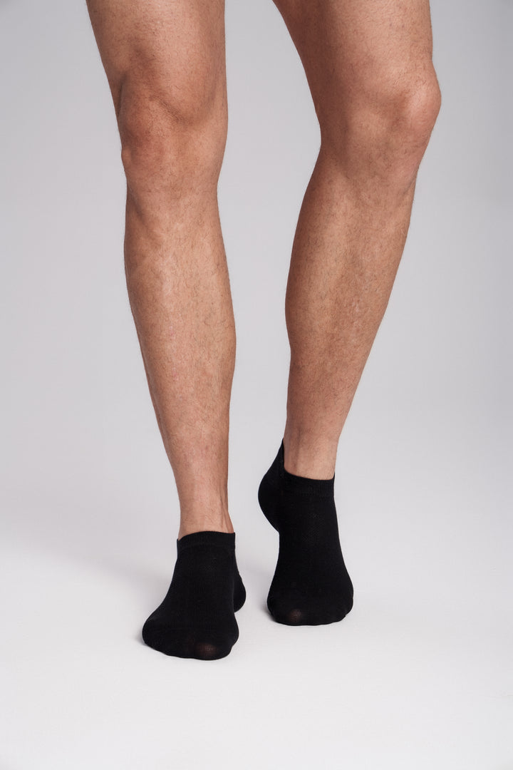 Soft women’s antibacterial ankle socks with massage sole design, breathable fabric, comfortable fit, and odor-resistant material perfect for daily wear and foot care.