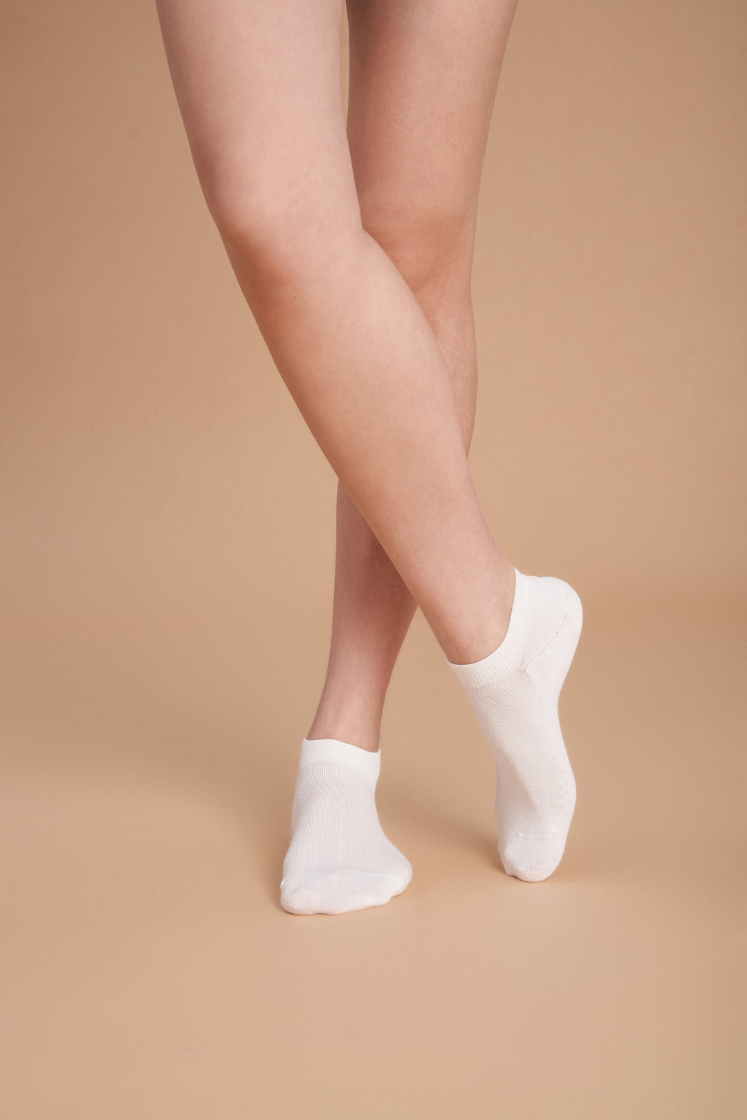 Soft women’s antibacterial ankle socks with massage sole design, breathable fabric, comfortable fit, and odor-resistant material perfect for daily wear and foot care.