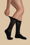 Black diabetic non-binding sock being pulled up