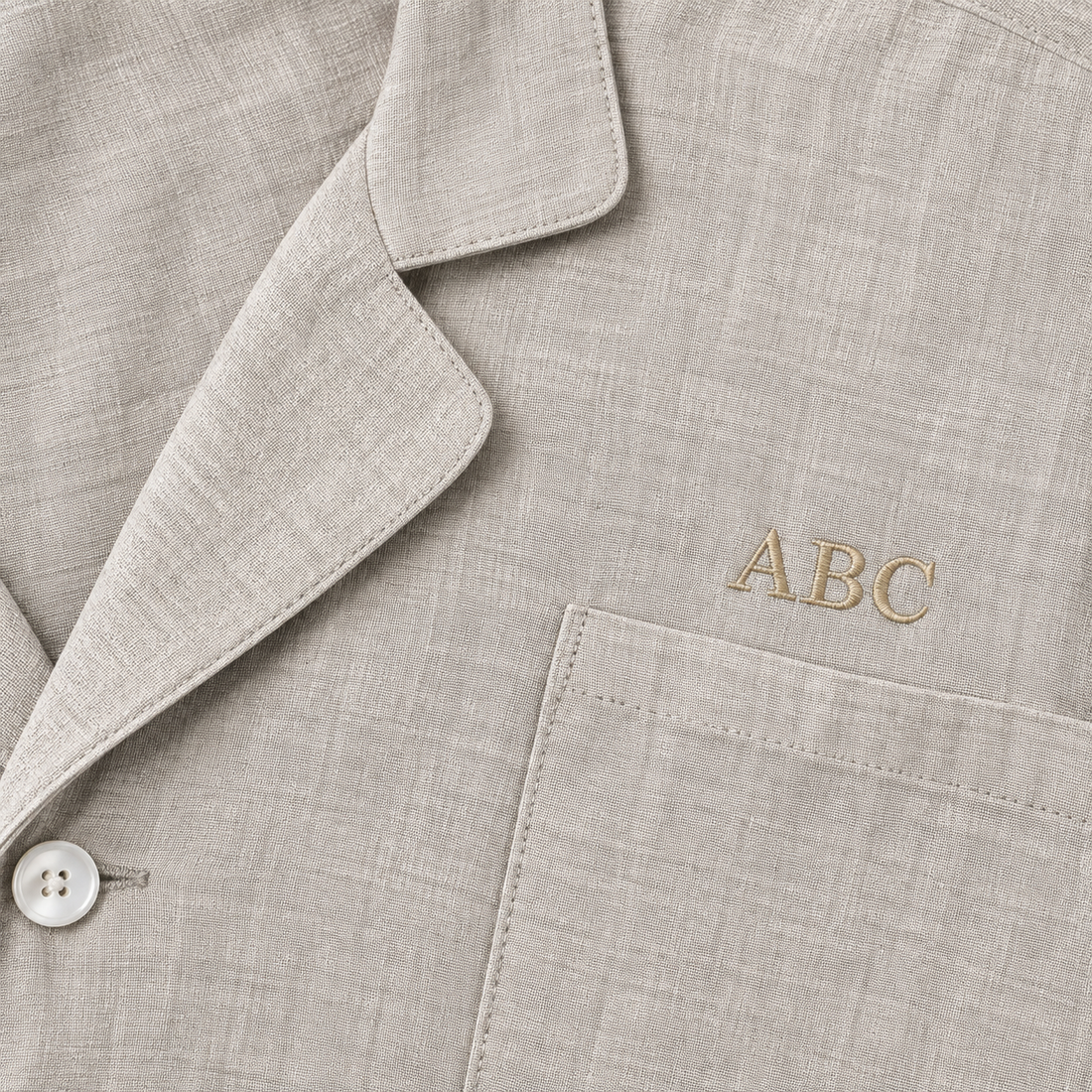 Personalized sleepwear with beige monogram ABC above the pocket