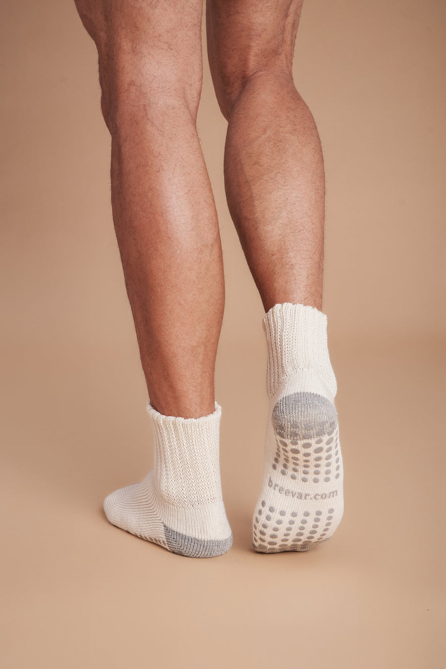 Men's crew socks with non-slip grip dots and gray heel and toe