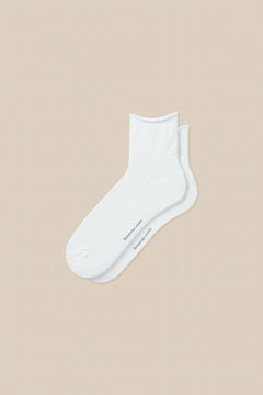 White roll top socks displayed flat